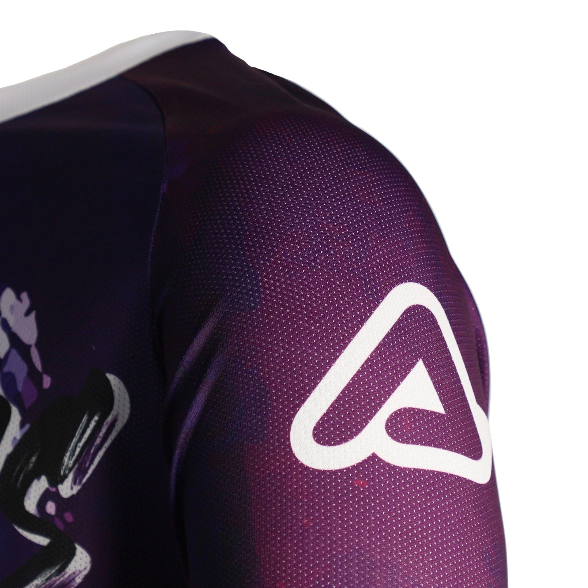 Close-up of a purple sports jersey with a white logo on a white background