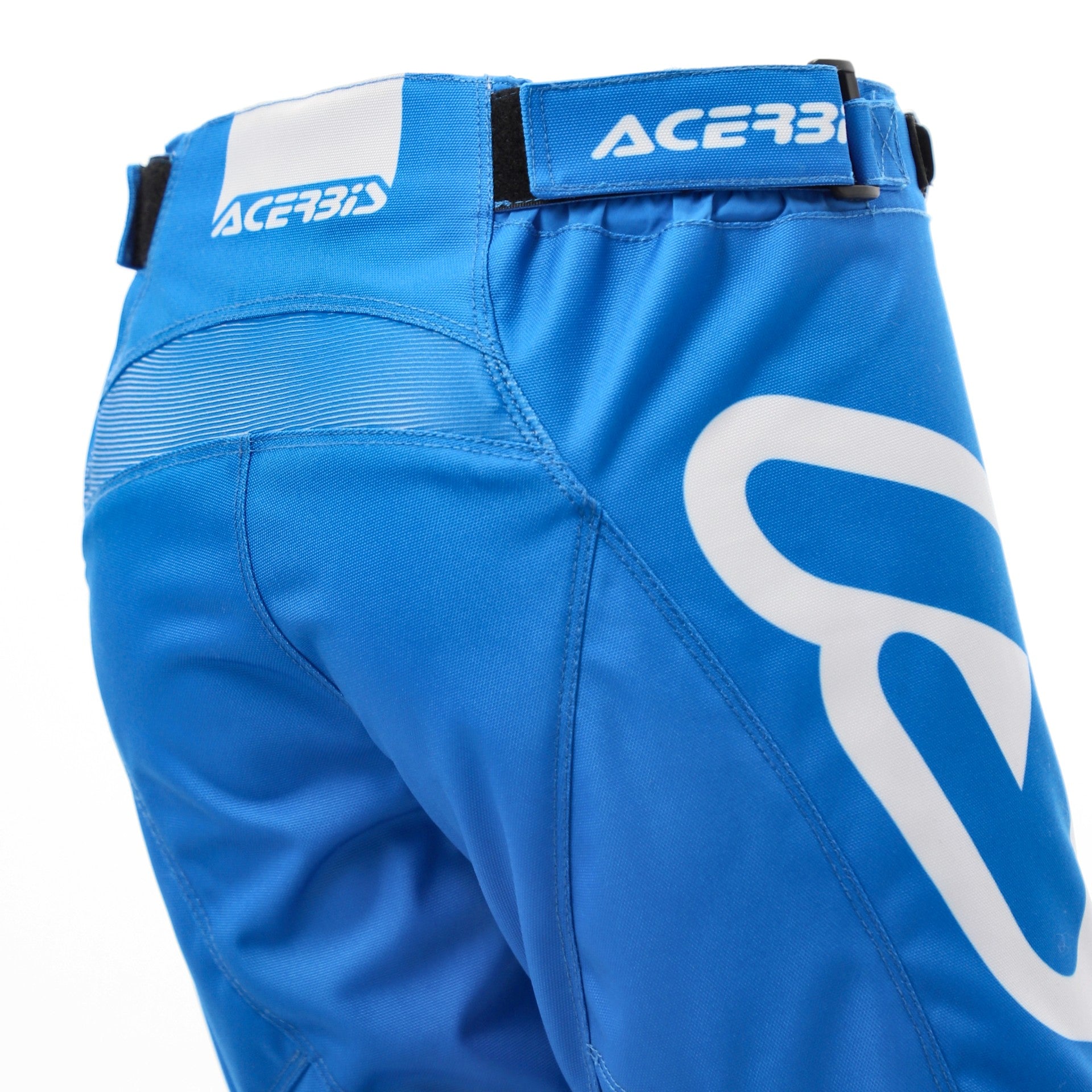 Blue protective pants with Acerbis branding on a white background