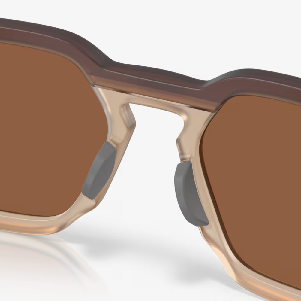 Sunglasses with brown lenses and beige frame on a white background