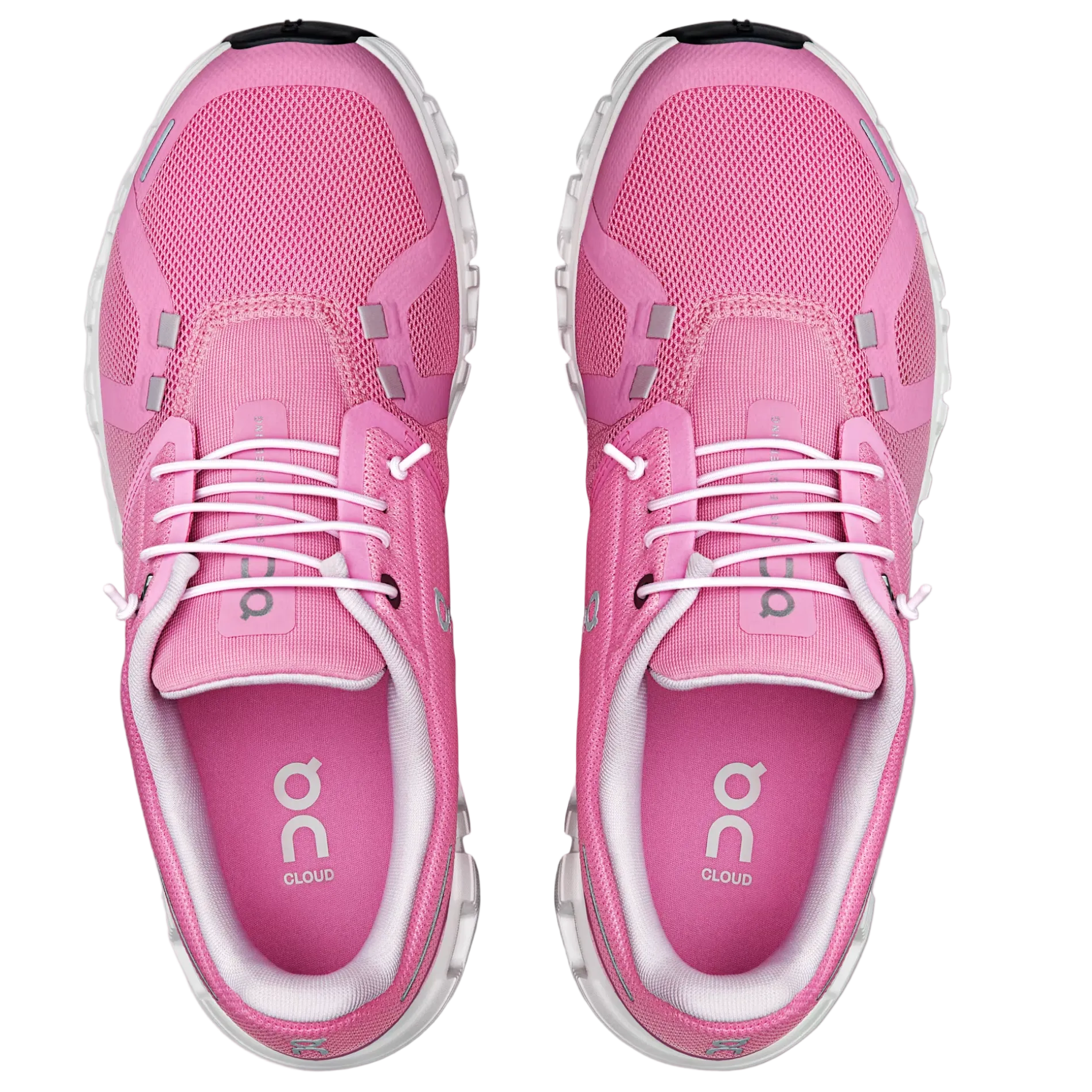 Pink running shoes with white laces on a light gray background