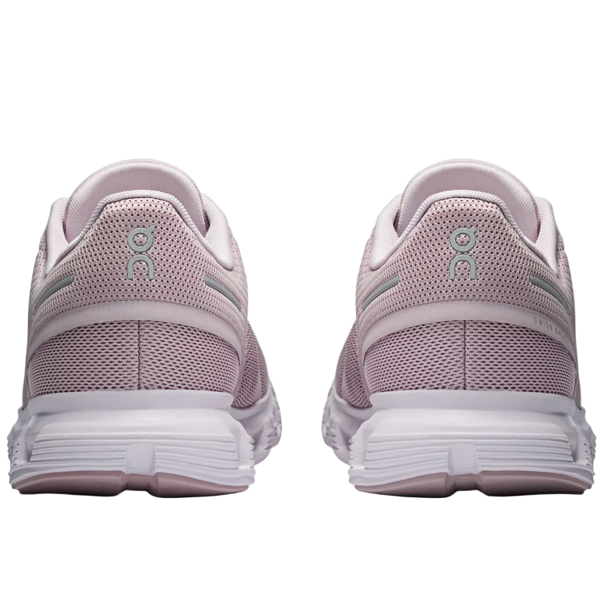 Pair of light purple running shoes with white soles on a light gray background