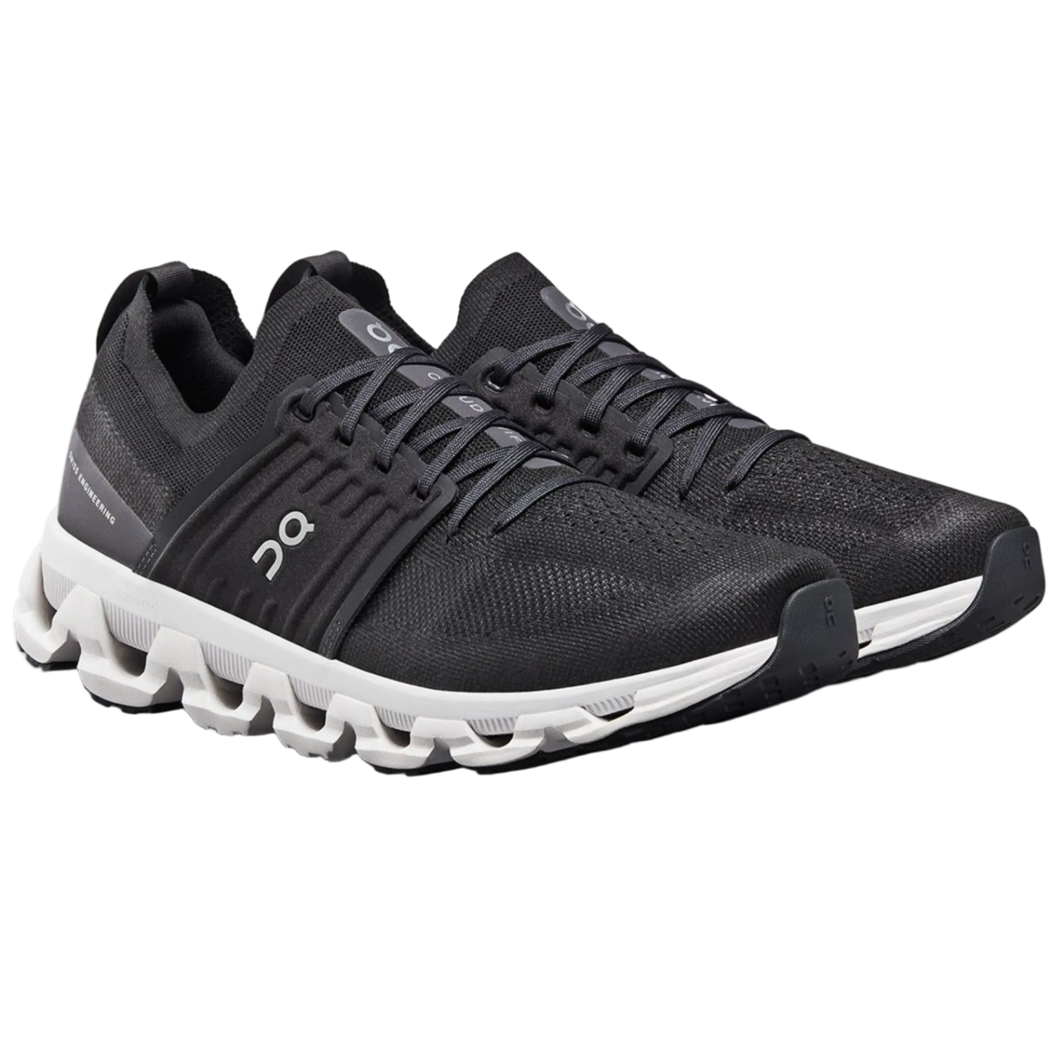 Black running shoes with white sole on a white background