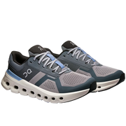 Pair of gray and blue running shoes on a white background