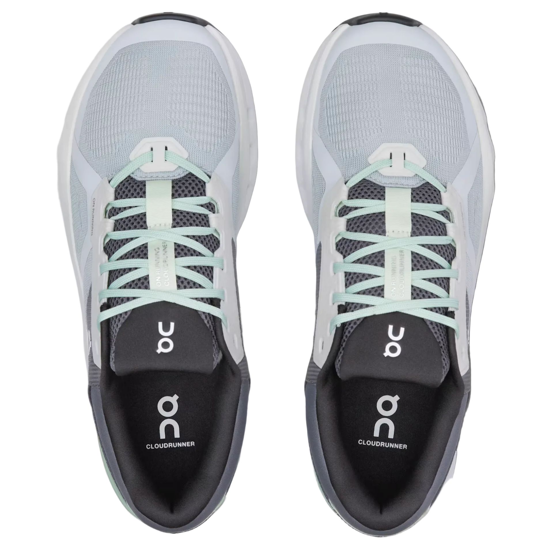 Pair of gray running shoes with white laces on a light gray background
