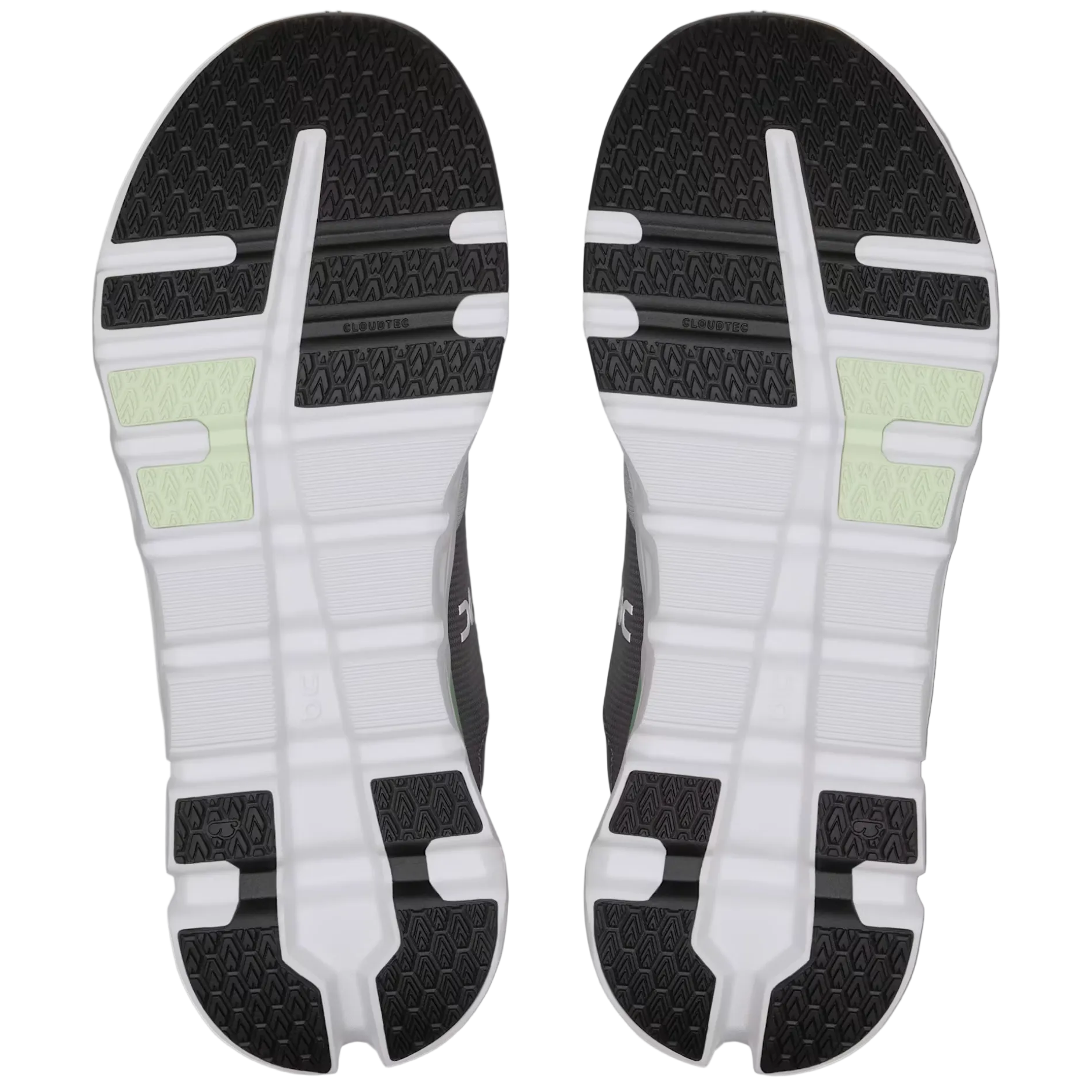 Pair of black and white athletic shoes on a light gray background