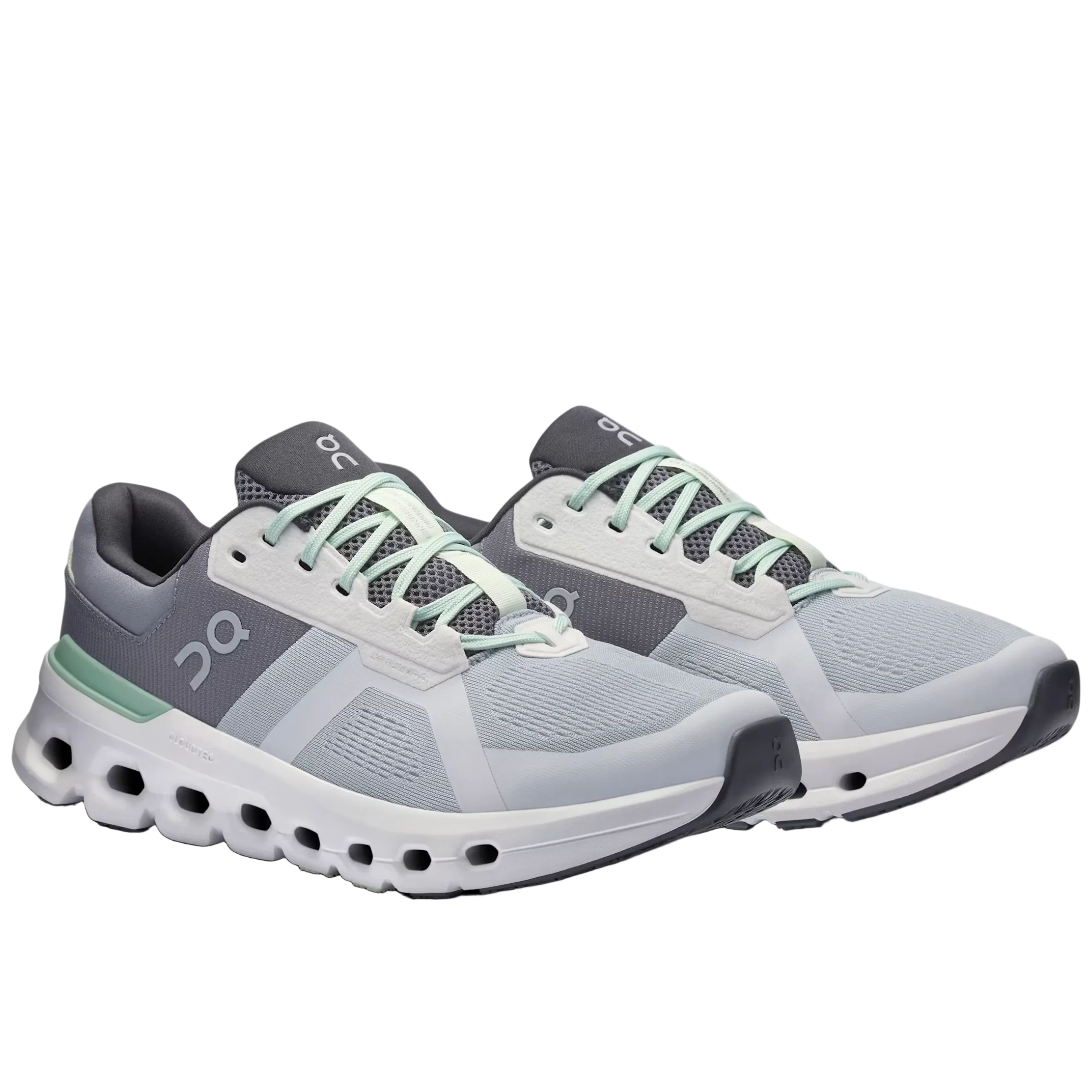 Gray and white running shoes with green accents on a white background