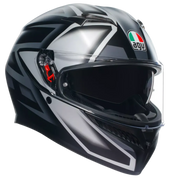 A full-face motorcycle helmet in glossy black and metallic silver with white graphic accents, featuring a clear visor and the AGV logo on the side.
