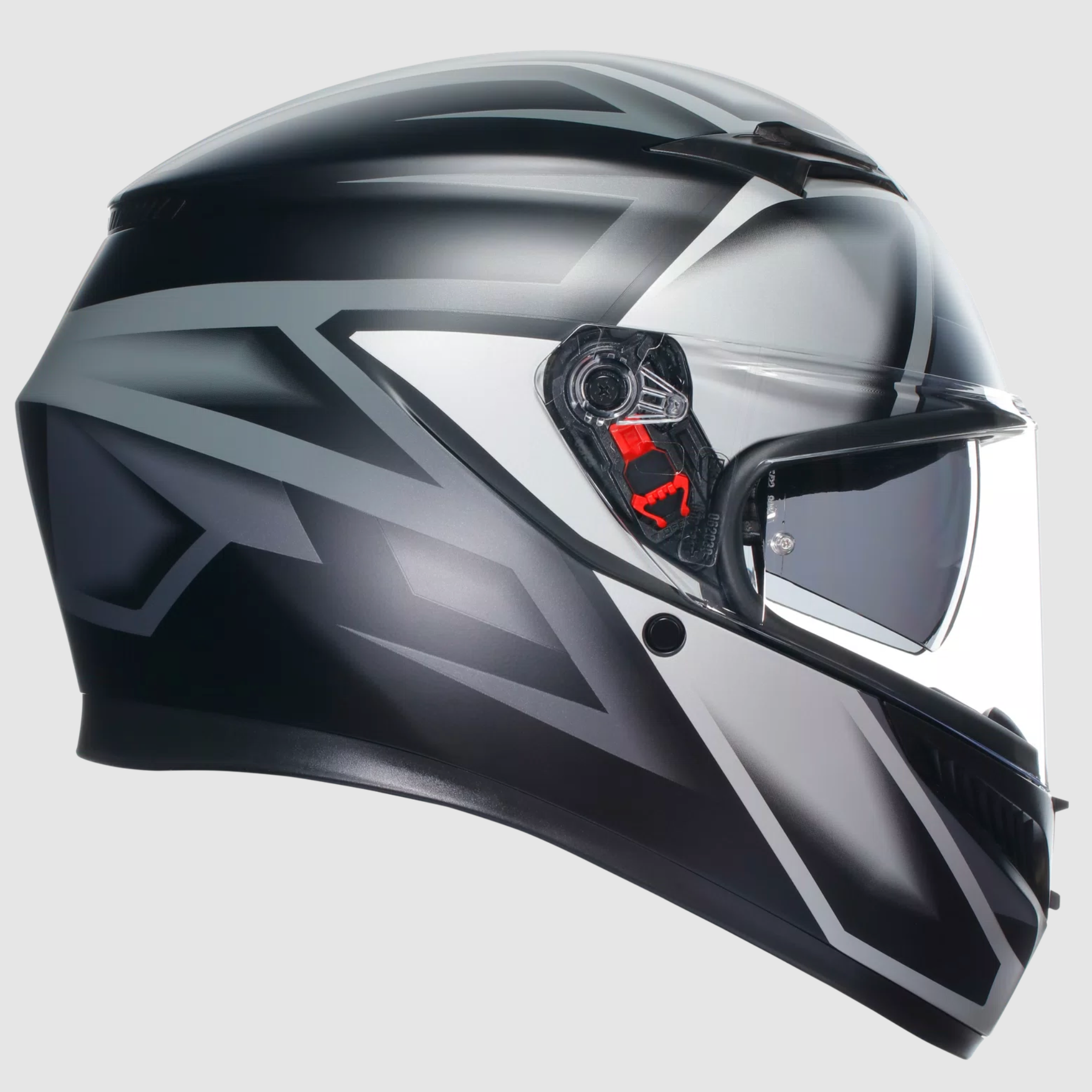 A full-face motorcycle helmet in a glossy black and silver color scheme with a clear visor and a small red accent near the side adjustment, shown against a light gray background.