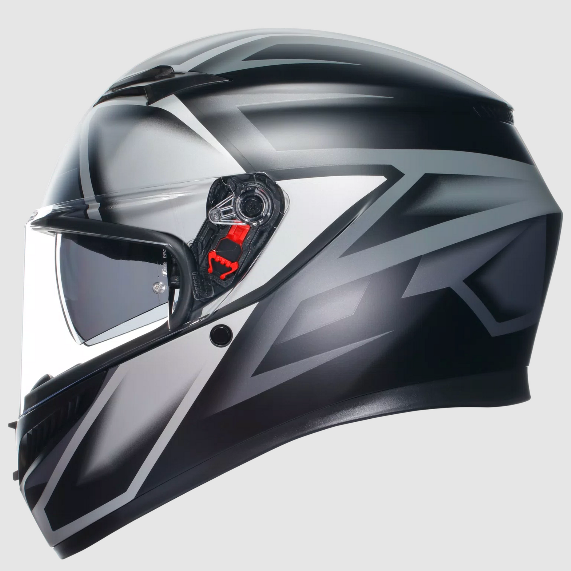 A full-face motorcycle helmet in a glossy black and dark gray color scheme with a clear visor and a small red accent near the side vent, shown against a light gray background.