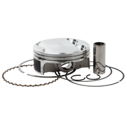 Piston set with piston, rings, and wrist pin on a white background