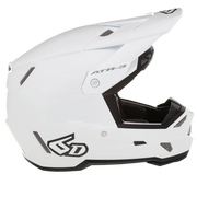 A white full-face motocross helmet with black accents, including the visor trim, chin bar, and graphics, shown from a side profile on a white background.