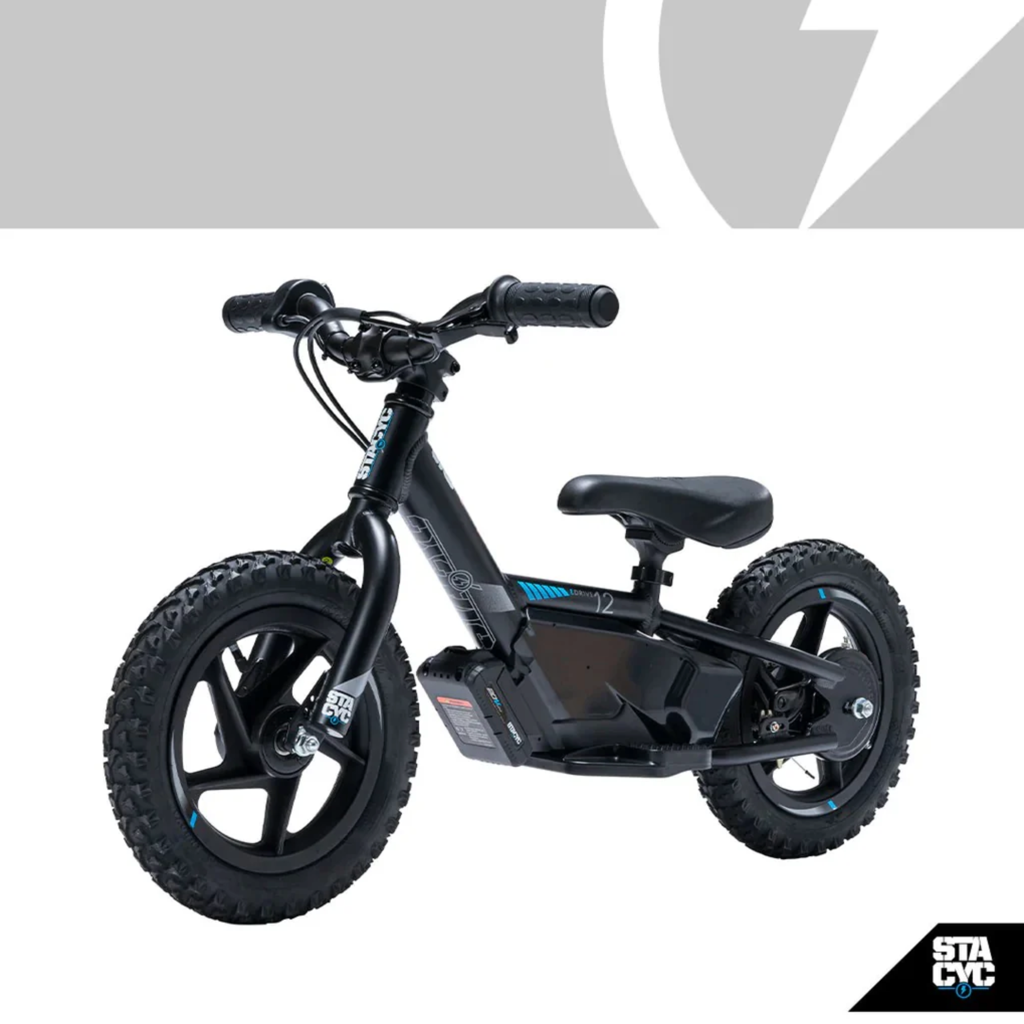 A black kids' balance bike with knobby tires and an integrated battery pack, shown on a white background with a gray logo banner at the top and a STA CVC logo in the bottom right corner.