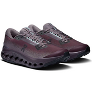 A pair of On Cloudrunning shoes in a dark plum-to-charcoal gradient, featuring a textured mesh upper, gray laces, and a distinctive black CloudTec sole, shown on a white background.