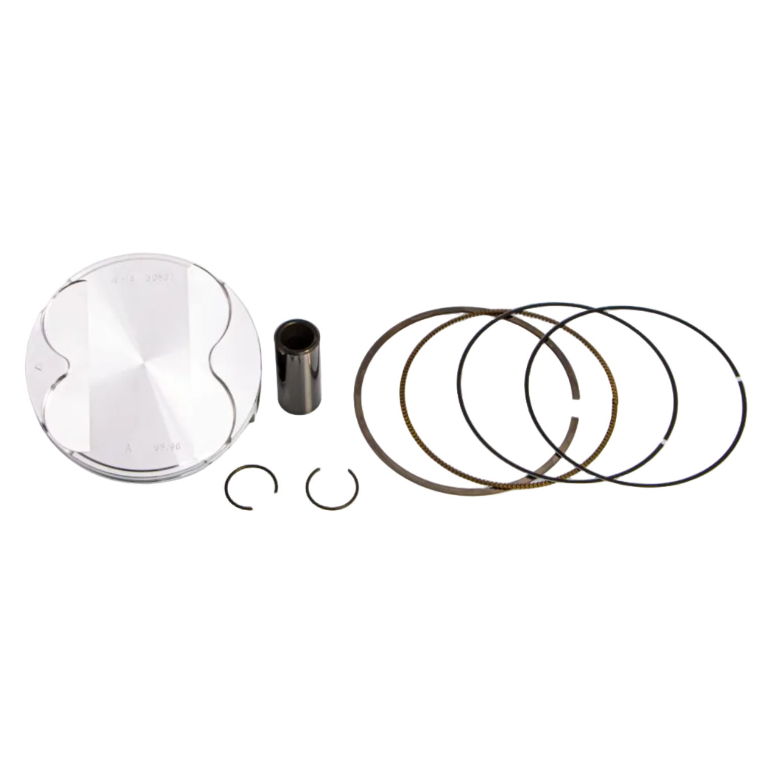 A piston ring kit laid out on a clean white background, including a shiny silver piston head, a dark metal rod, two small clips, and several piston rings in dark gray and bronze tones.